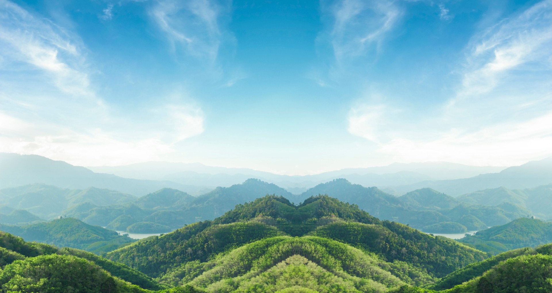 World environment day concept: Green mountains and beautiful blue sky clouds