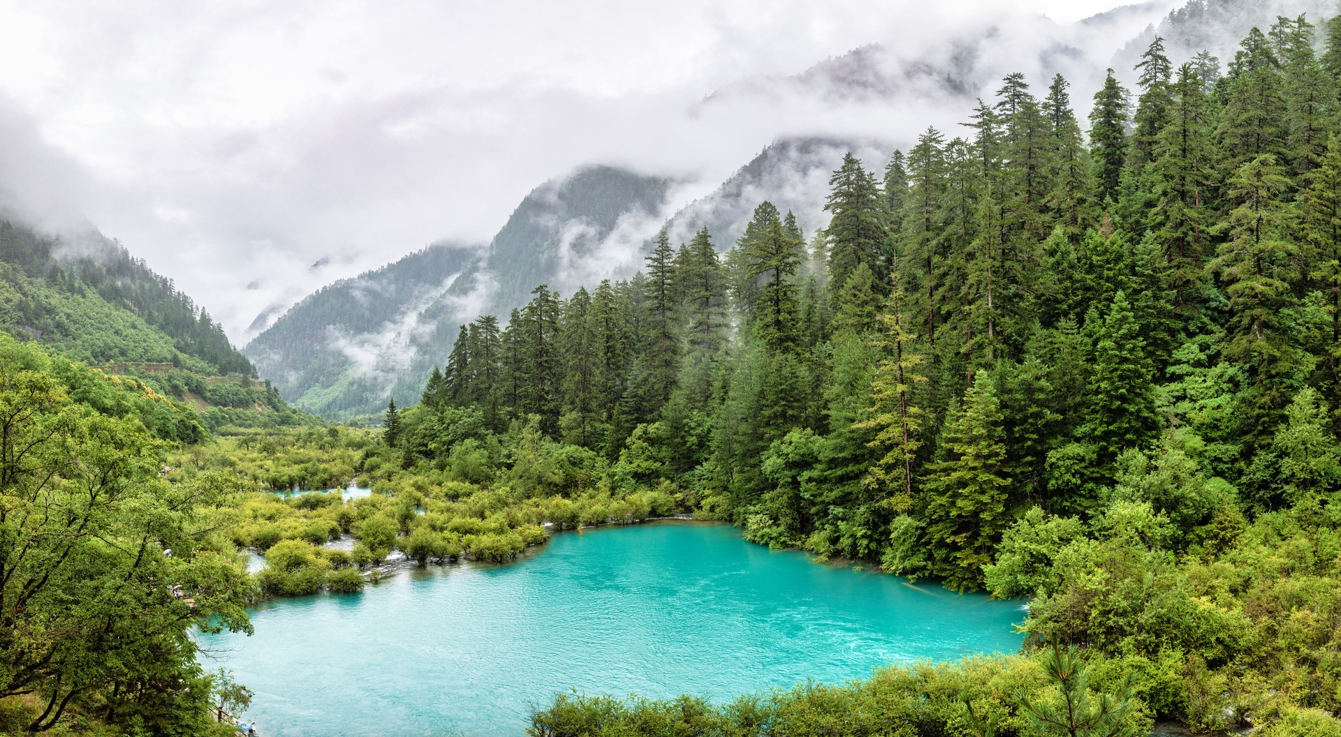 Turquoise Lake in the Misty Mountains of Jiuzhaigou